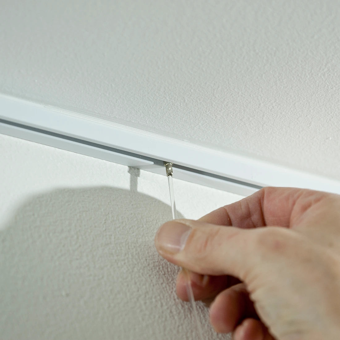 Closeup foto perlondraad vast klikken in Contour Rail