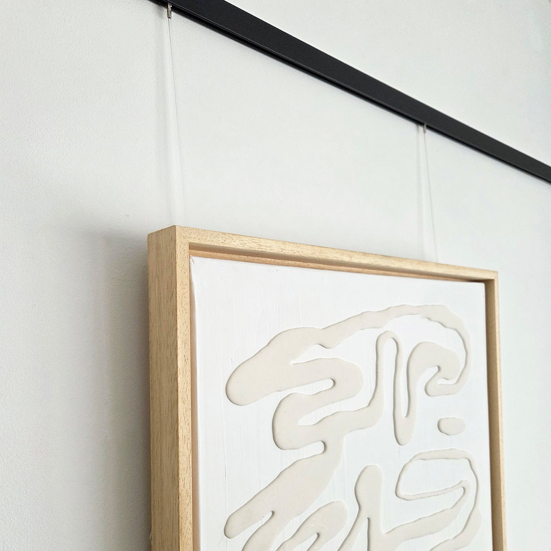 schilderij aan twister ophangdraad