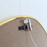 Newly Ophanghaak H50 bevestigd aan achterkant spiegel